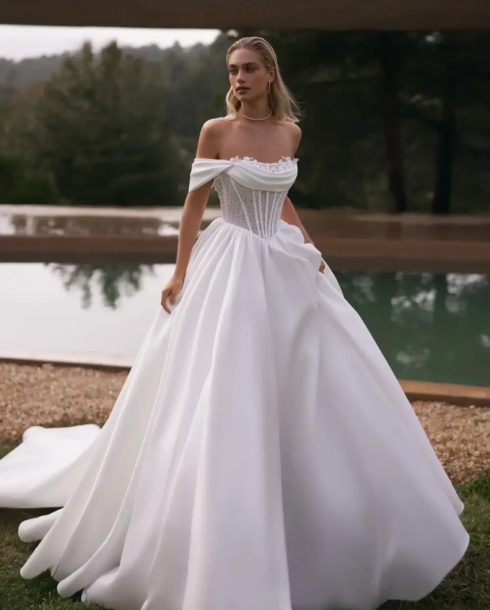Model wearing a white gown